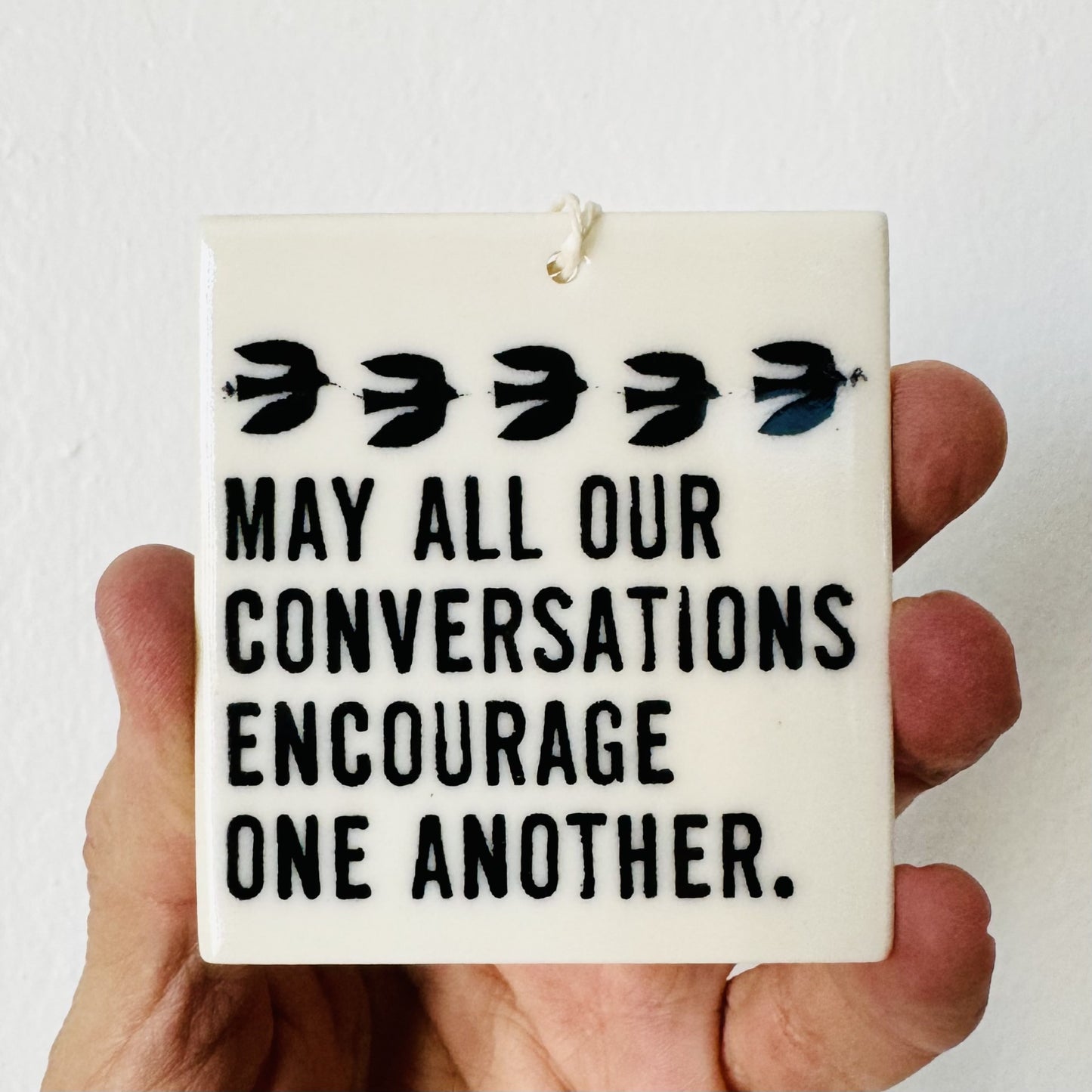 may all our conversations encourage one another ceramic wall tag