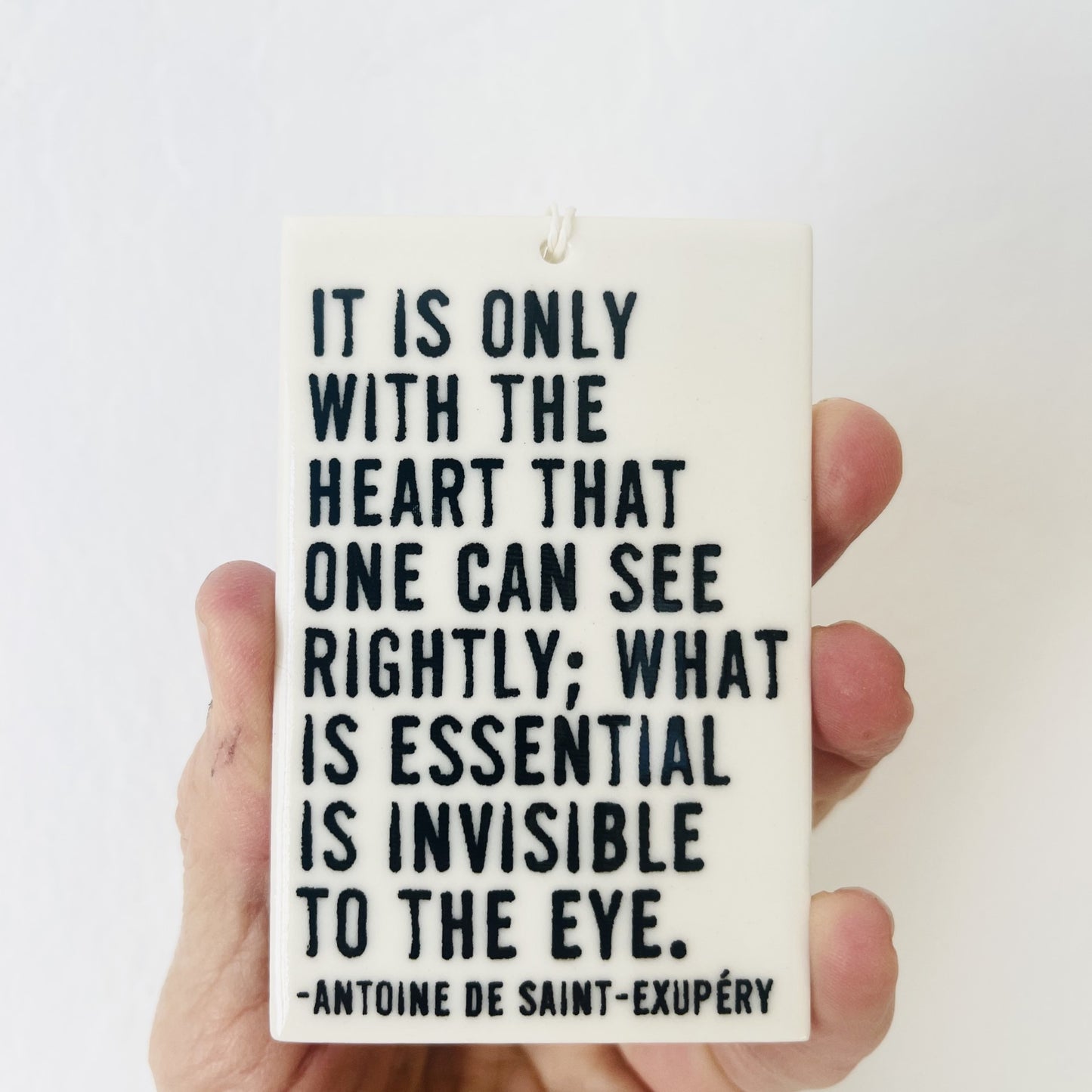 antoine de saint-exupery quote ceramic wall tag