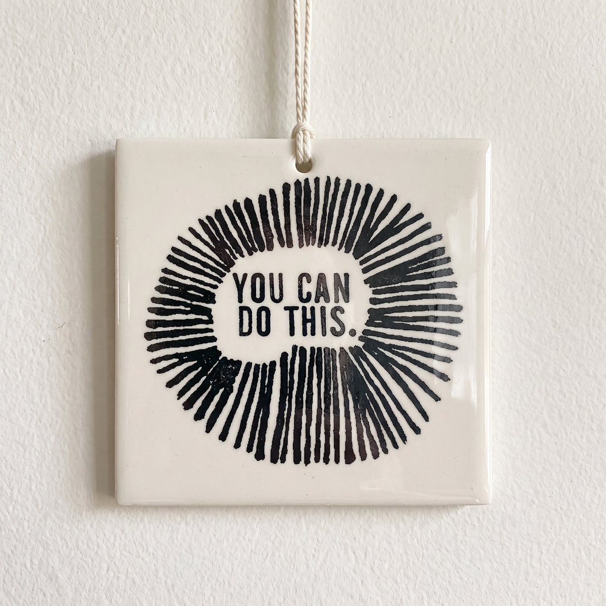 Porcelain wall tag: YOU CAN 
DO THIS.