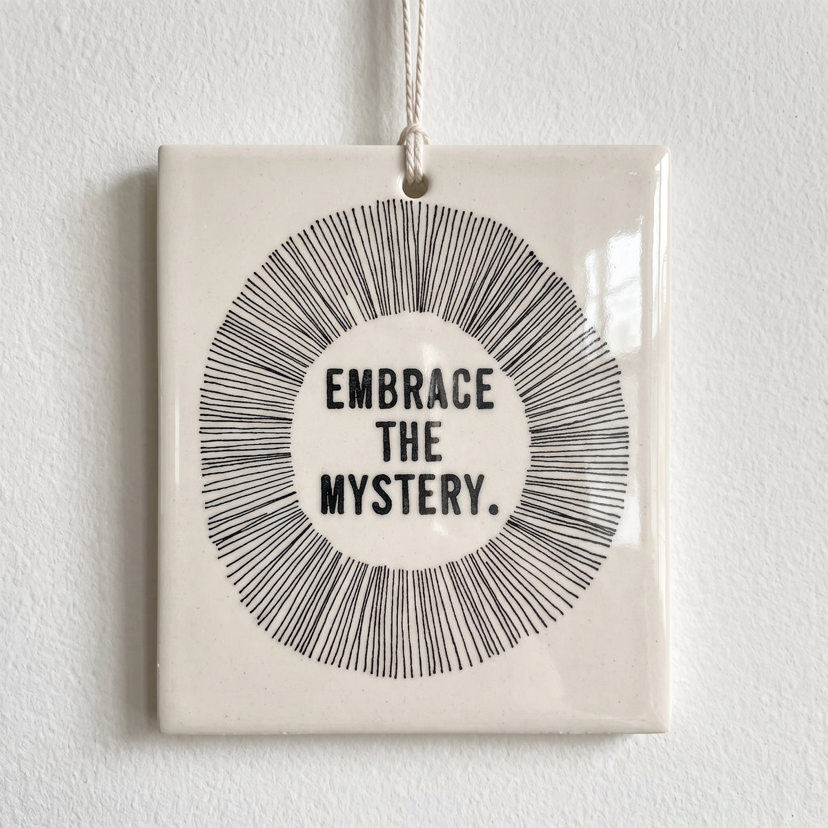 Porcelain wall tag: EMBRACE
THE
MYSTERY.