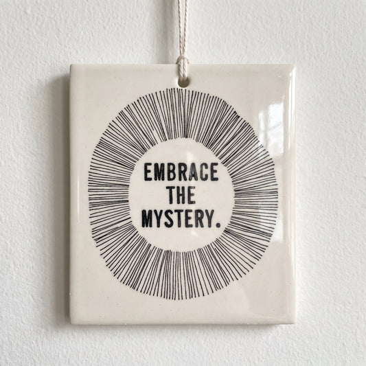 Porcelain wall tag: EMBRACE
THE
MYSTERY.