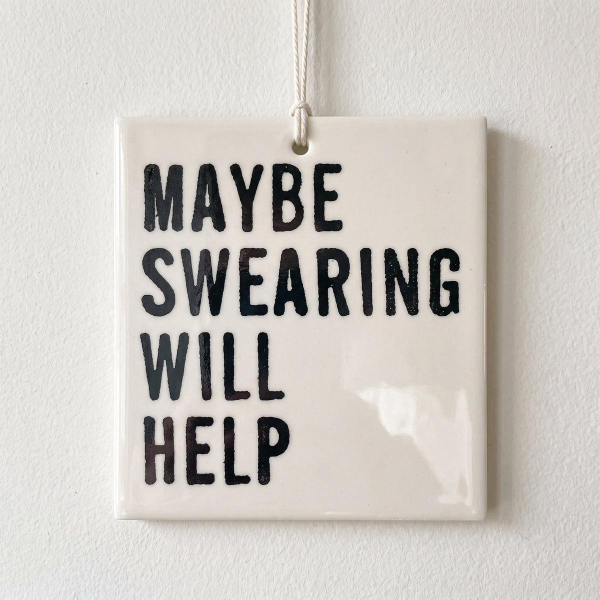 Porcelain wall tag: MAYBE SWEARING
WILL 
HELP