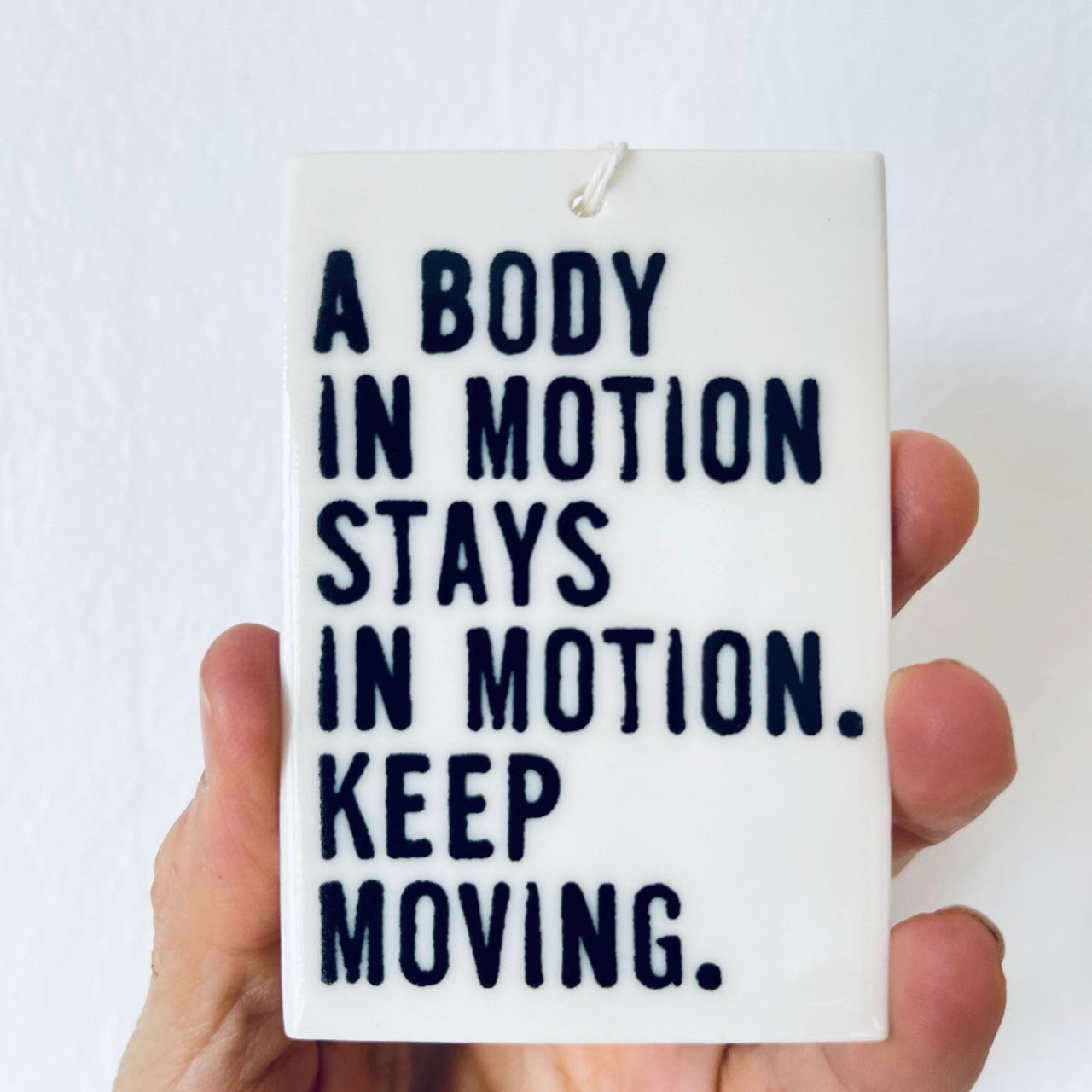 move your body ceramic wall tag
