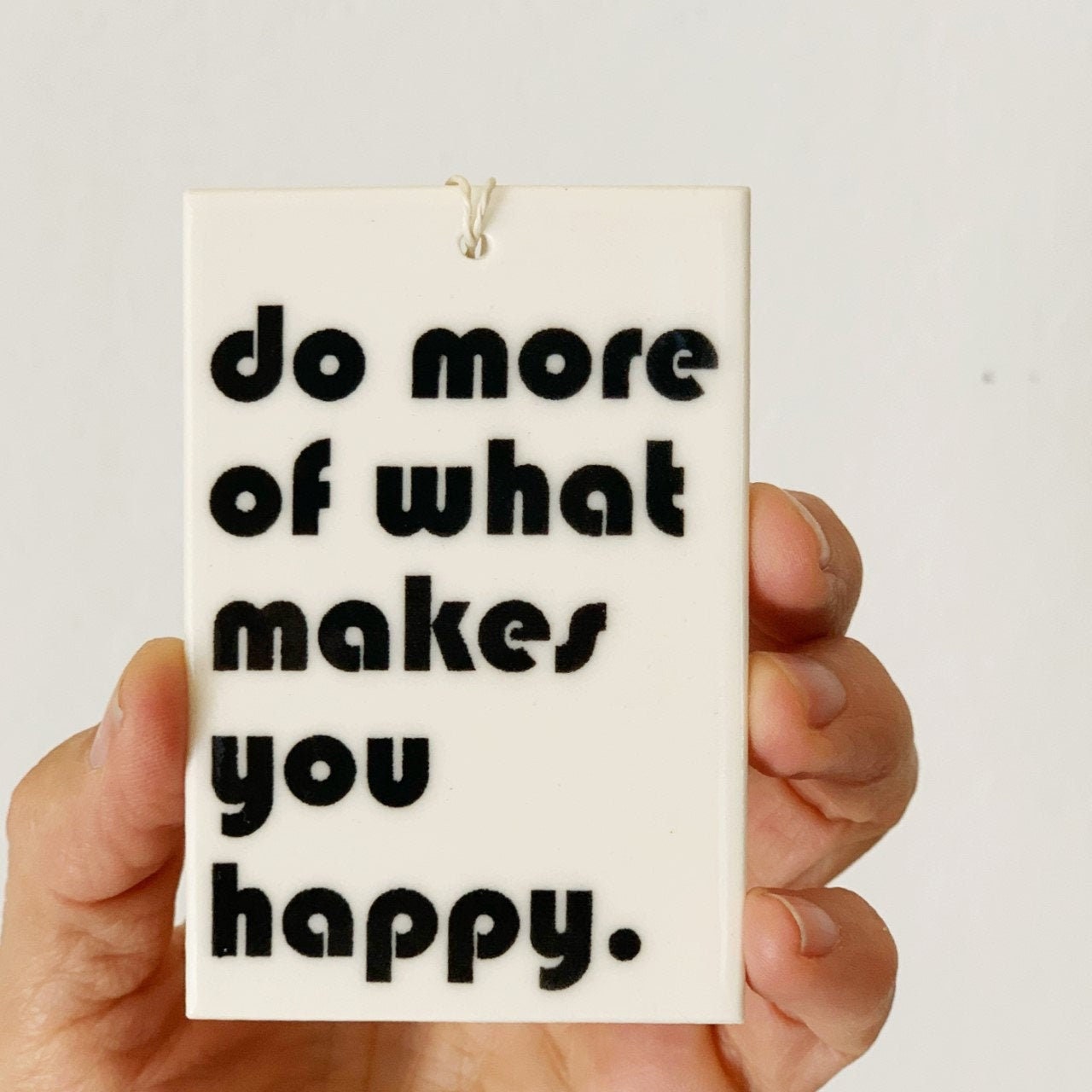 do more of what makes you happy ceramic wall tag