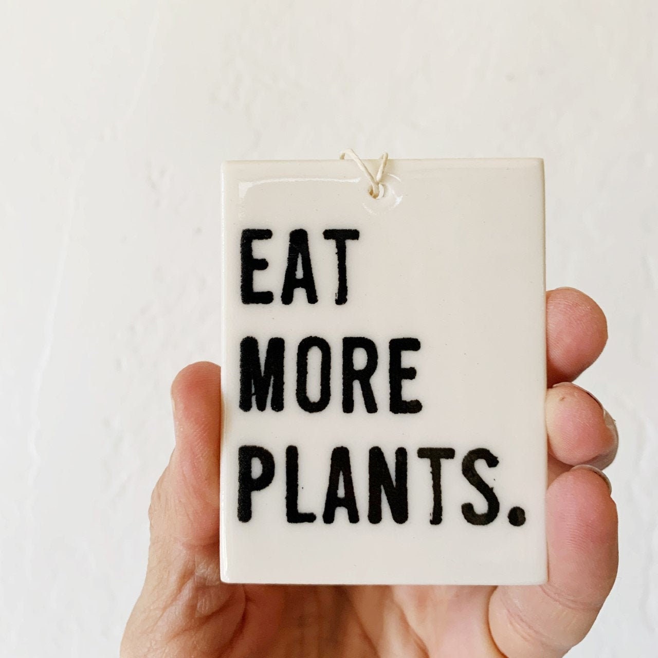 eat more plants ceramic wall tag